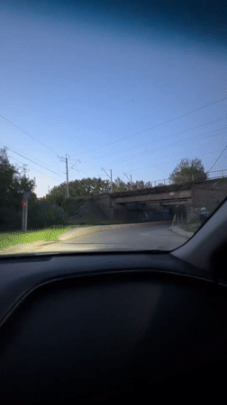 Passenger train crosses bridge in Ferma, Russia