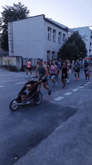 Evening street race winds through Piaseczno with police and mixed traffic
