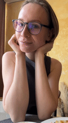 Woman smiles at camera during morning moment in Khimki