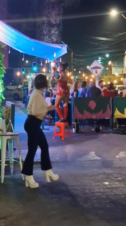 Burlesque performer entertains diners at Iquique restaurant