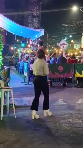 Burlesque performer entertains diners at Iquique restaurant
