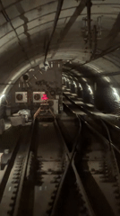 Vehicle travels through subway tunnel, captured on video
