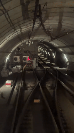 Vehicle travels through subway tunnel, captured on video