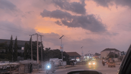 Evening street life documented in Abuja during sunset