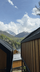 Mountain landscape filmed from wooden building in Almaty