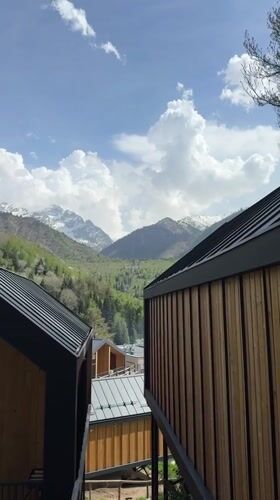 Mountain landscape filmed from wooden building in Almaty