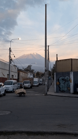 Evening street activity and mountain views documented in Arequipa