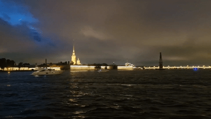 Peter and Paul Fortress glowing along the Neva at night