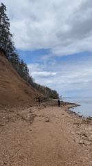 Morning scenes documented along Noviy waterfront including walker, sculpture