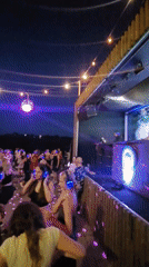 Silent disco lights up a Warsaw waterfront on a summer evening