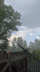 Stormy, foggy morning settles over a rural Russian village