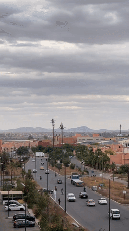 Everyday moments captured on Marrakesh streets during afternoon drive