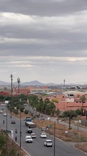 Everyday moments captured on Marrakesh streets during afternoon drive