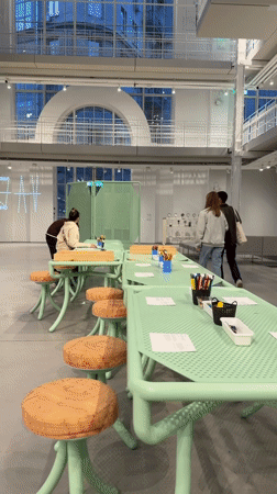 Art workspace and business meeting observed in Moscow building