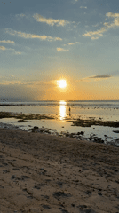 Sunset captured at Indonesian beach with golden reflections