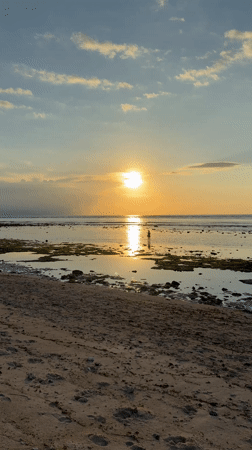 Sunset captured at Indonesian beach with golden reflections