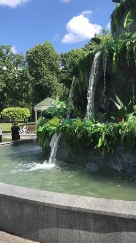 Park visit with waterfall and metallic animal sculpture in Kharkiv
