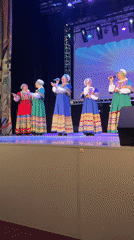 Folk dancers perform in traditional costumes in Chaikovsky auditorium