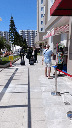 Woman with champagne flute observed indoors in Aksu, Turkey