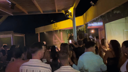 Live outdoor night event at a marine-decorated venue in Vejer