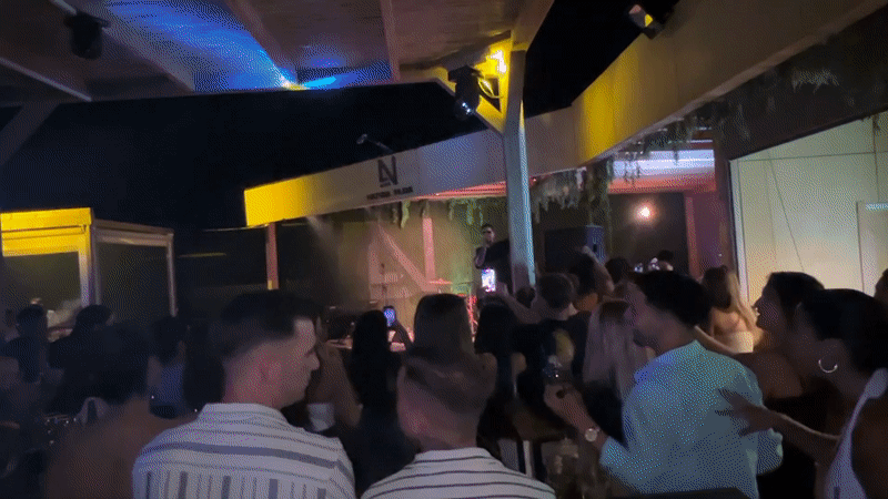 Live outdoor night event at a marine-decorated venue in Vejer