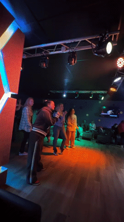 Karaoke night captured at Peresvet bar with hookah smoking