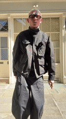 Person in black outfit, yellow sunglasses spotted walking in London