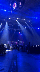 Fight night setup inside a dimly lit MMA arena