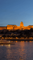 Buda Castle illuminated at twilight in Budapest evening view