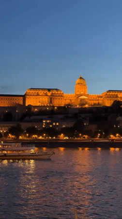 Buda Castle illuminated at twilight in Budapest evening view