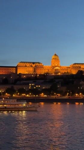 Buda Castle illuminated at twilight in Budapest evening view