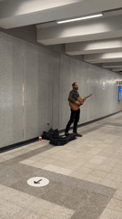 Street musician performs in Montreal subway tunnel late night
