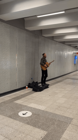 Street musician performs in Montreal subway tunnel late night