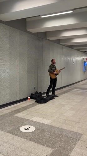 Street musician performs in Montreal subway tunnel late night