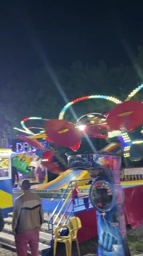 Evening amusement park fun in Kiten with rides and sunset views