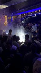 Late night DJ set in Paris with fog effects