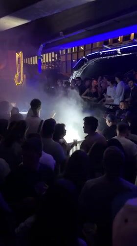 Late night DJ set in Paris with fog effects