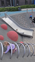 Children play at Moscow park playground and water features
