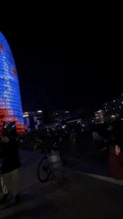 Building projection draws evening crowds in Barcelona square