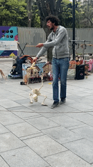Street performer operates skeleton puppet in Stara Zagora park