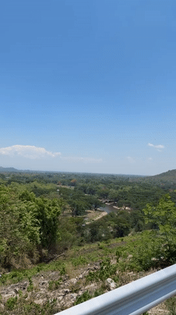 Tourists photograph scenic overlook in Ban Thung Ma Nio Thailand