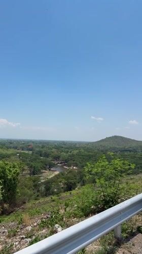 Tourists photograph scenic overlook in Ban Thung Ma Nio Thailand