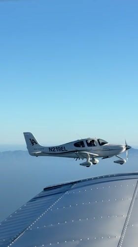 Wing-mounted camera catches two planes flying in formation