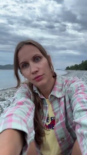 Woman documents beach visit in Fethiye, Turkey coastline
