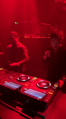 Live DJ set at a red-lit club in North Kuta, Bali