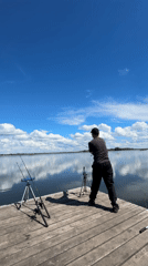 Couple enjoys peaceful fishing trip on sunny lake morning