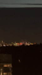 Fireworks over Coquitlam at twilight, viewed from above