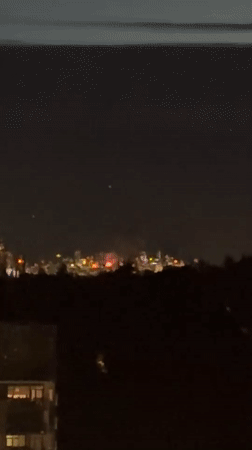 Fireworks over Coquitlam at twilight, viewed from above