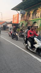 Morning traffic and street life in small-town East Java