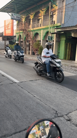 Morning traffic and street life in small-town East Java